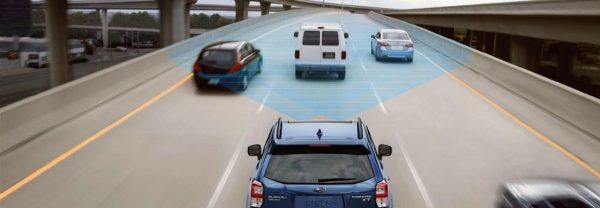 Subaru displaying EyeSight technology behind 3 cars on the freeway